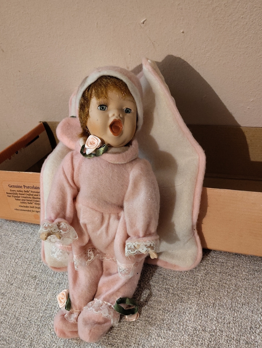 Pink Porcelain Baby Doll with Rose Accents